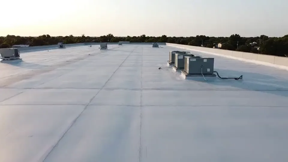 A large flat commercial roof with rooftop units