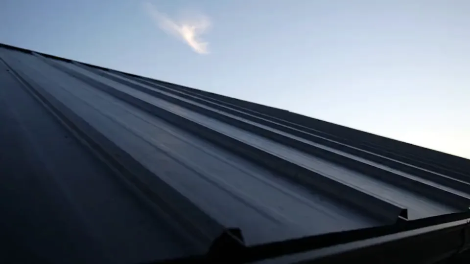 Standing seam metal roof panels against the sky