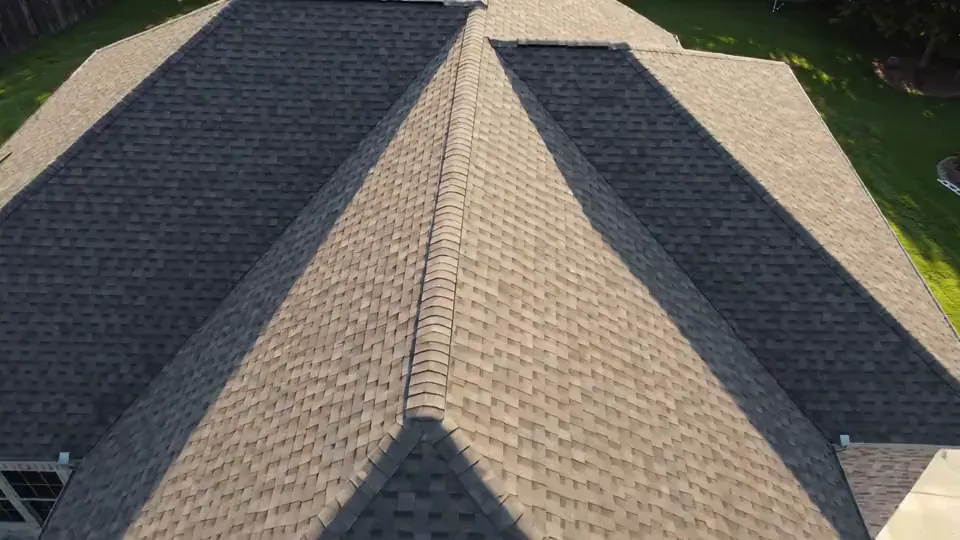 A complete gray architectural shingle roof from above
