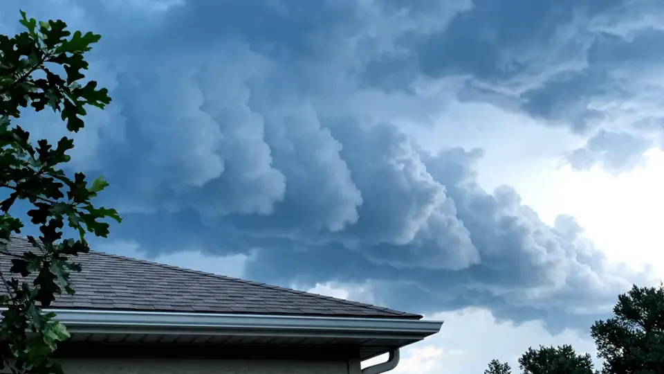 A dark gulf squall line stacked over a rooftop