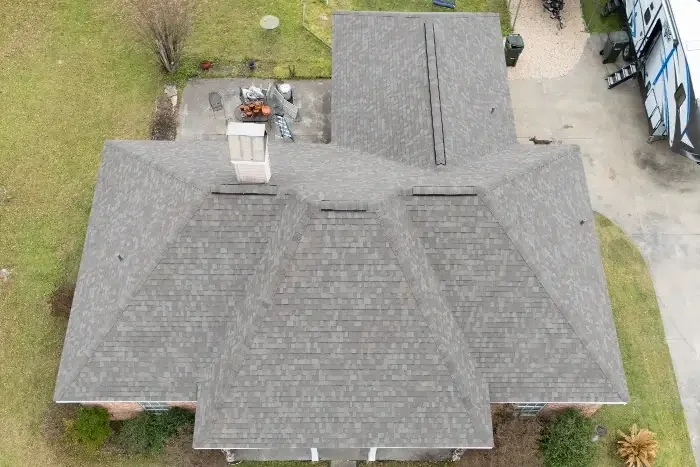 The same roof finished with gray architectural shingles